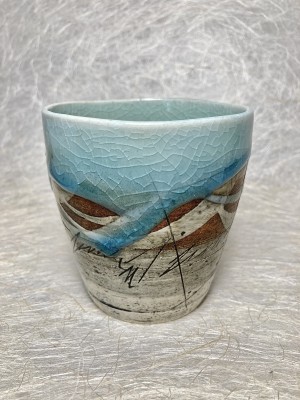 Theetas blauw met duinen.