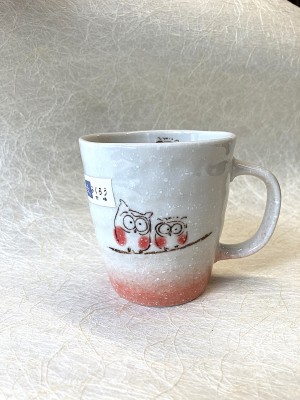 Mug rode uiltjes.